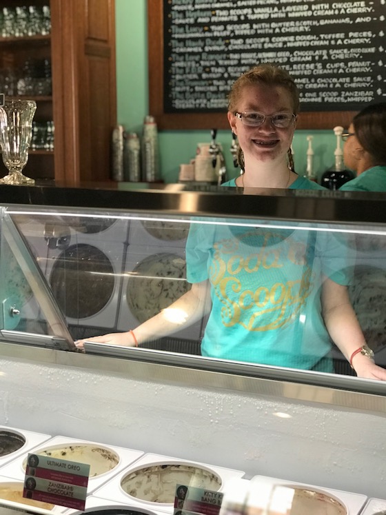 Stephanie happily working in an ice cream shop 